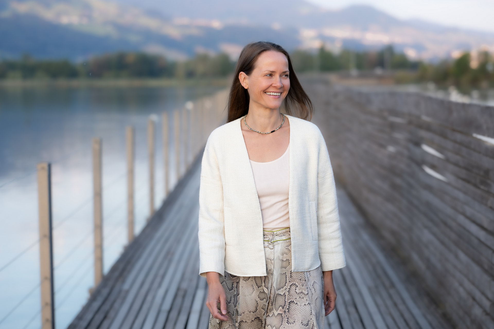 Marta Caprez walking on a lakeside pier